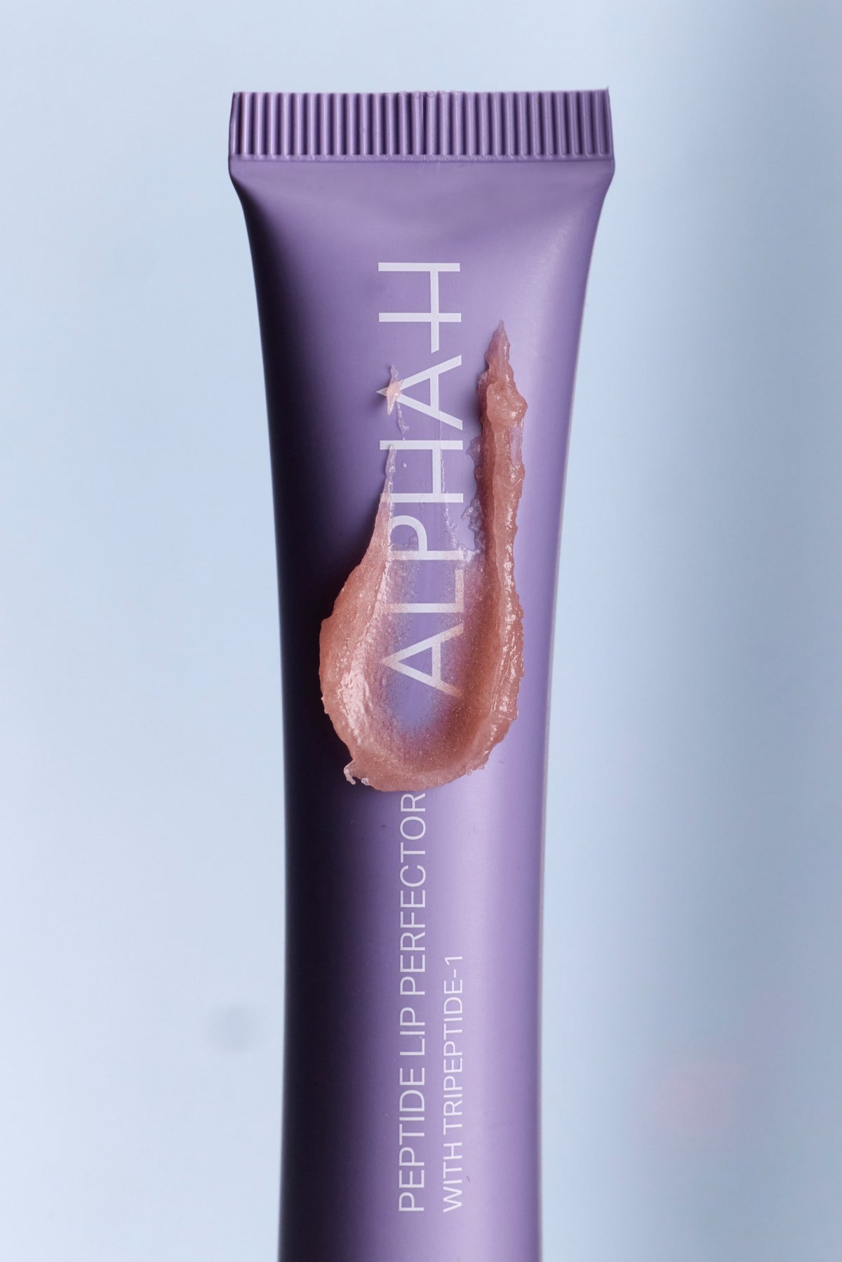 Alpha-H Peptide Lip Perfector tube avec texture
