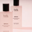 BDK Parfums Hair Perfume Impadia gros plan de deux flacons sur fond rose