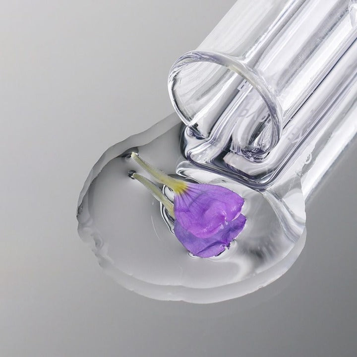 Medik8 Bakuchiol Peptides 30ml pipette avec sérum et fleur violette