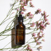 Oolaboo Essential Cocktail Purifying entre de petites fleurs roses